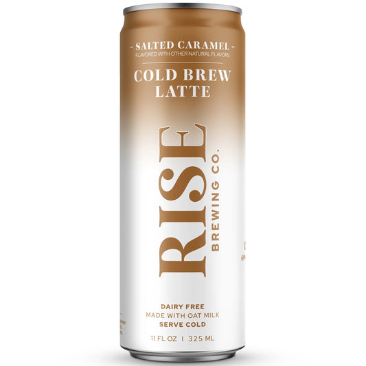 A single aluminum can of Rise Brewing Co. Salted Caramel Cold Brew Latte, featuring a white and caramel-brown gradient design with gold lettering, set against a plain white background.